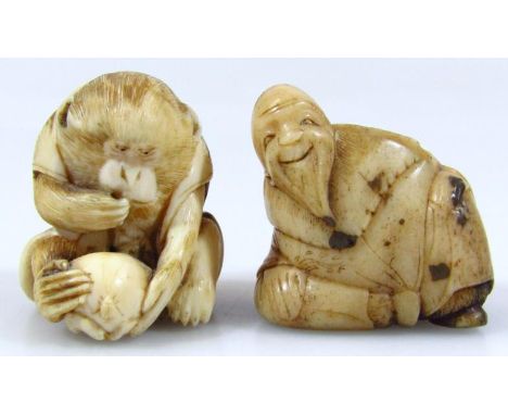 A Japanese Meiji period netsuke, formed as a monkey holding nut, in flowing cloak, with carved floral underside, initialled b