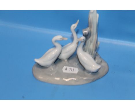 A NAO FIGURE GROUP OF DUCKS