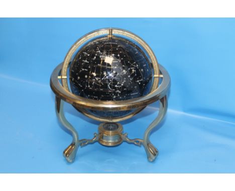 AN CELESTIAL GLOBE MOUNTED IN A BRASS MOUNT