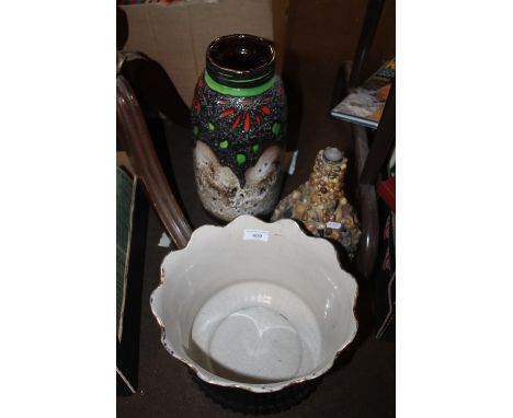 A WEST GERMAN STYLE VASE TOGETHER WITH A CERAMIC PLANTER AND A SHELL COVERED GLASS BOTTLE