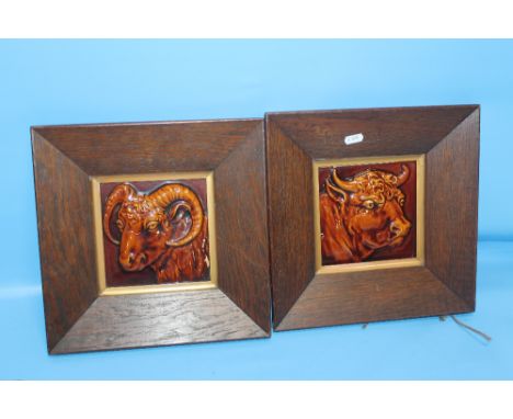 TWO OAK FRAMED CERAMIC PLAQUES, ONE OF A RAM AND ONE OF A BULL