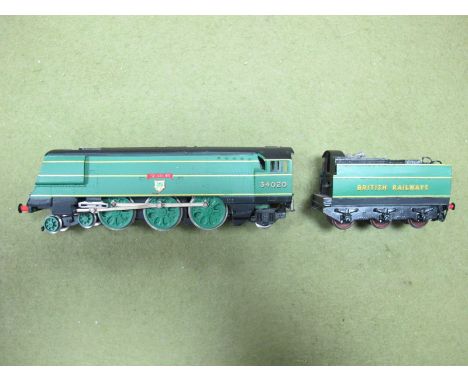 A 'OO Scale 4-6-2 West Country Locomotive by Wrenn, repainted. Named 'Seaton' R/No. 34020 with brass built tender.