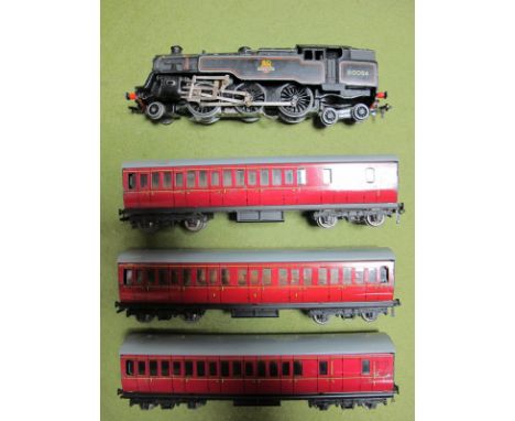Hornby Dublo Three Rail 4-6-2 Standard Tank R/No. 80054, plus three suburban coaches. All fair.