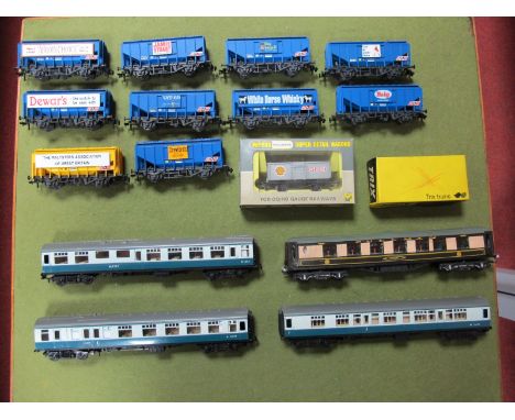 A Quantity of 'OO' Trix Closed Hopper Wagons, a boxed Wrenn Wagon/Graham Farish Pullman and three Trix BR coaches.