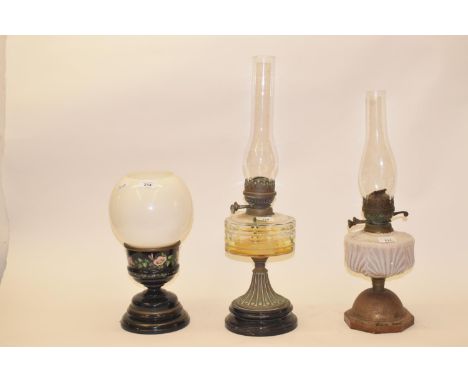 A late 19th/early 20th century gilt metal oil lamp, with turquoise glass well, and five others (6)White font with hairline cr