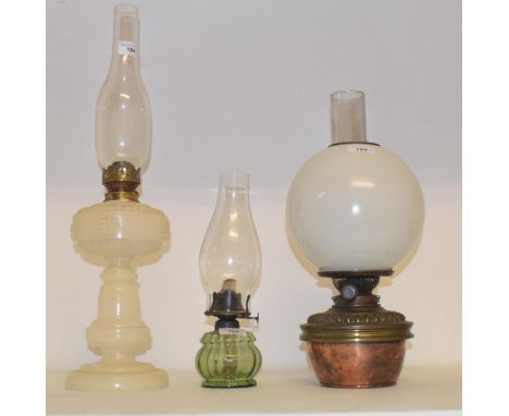A late 19th/early 20th century brass oil lamp, in the form of a Corinthian column with amber glass well, and nine others (10)