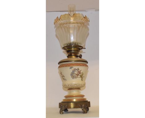A Royal Worcester bush ivory oil lamp, with gilt metal mounts, date mark for 1876-91, 60 cm highOverall condition good, no ch