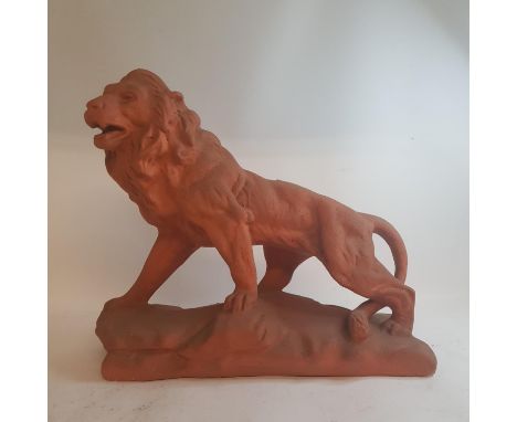 A Chinese pottery vase lamp, 59 cm high, a terracotta lion, and other items 