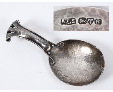 An Arts &amp; Crafts style silver caddy spoon, the flared handle with scrolls going into the bowl, Amy Eleanor Stewart, Chest