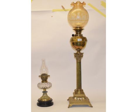 A late 19th/early 20th century brass and onyx oil lamp, in the form of a column, with amber glass shade, 100 cm, and another 