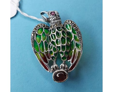 A silver plique-à-jour eagle brooch/pendant set with cabochon garnet, ruby eye and marcasitesmodern 