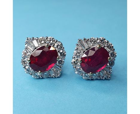 A pair of 18ct white gold treated ruby and diamond cluster studs, boxed, rubies 5.54ct, diamonds (RBC and tapered baguette) 1