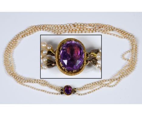 A four row seed/cultured pearl necklace, with an amethyst claspSome discoloration 18.8 grams gross 