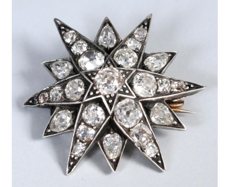 A late Victorian/Edwardian diamond star brooch, set 25 diamonds, 3 cm widesmall  inclusions with 10x lens,  no noticeable to 