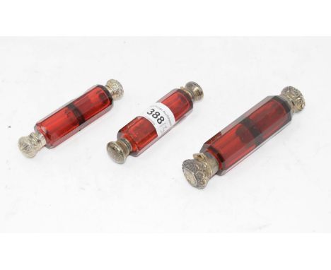 A Victorian ruby glass double ended scent bottle, 12.5 cm, and two others similar (3) 