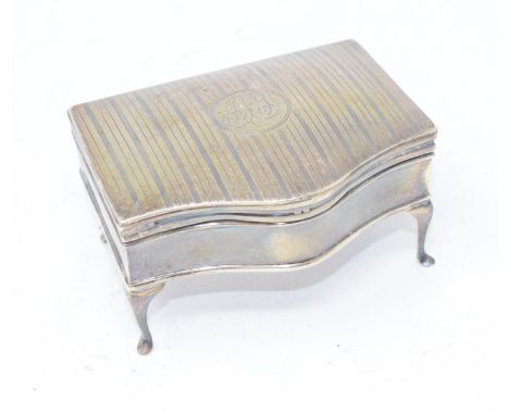 An early 20th century silver trinket box, initialled, and with engraved decoration, probably Birmingham 1911, 9.5 cm wide 