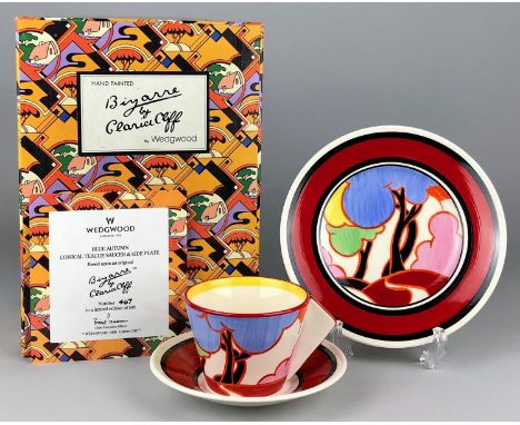 A Wedgwood ?Bizarre by Clarice Cliff? limited edition trio in the Blue Autumn pattern, comprising a conical tea cup, saucer a