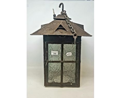 An Arts and Crafts style lantern, with a wrought iron bracket, a wall hanging oil lamp, and two scroll bracketsA metal mount 