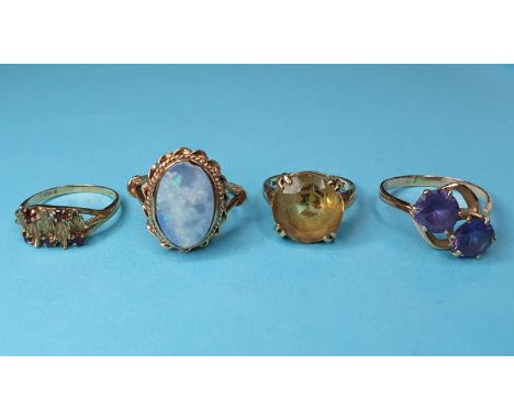 A 9ct gold and opal ring, approx. ring size Q½, and three other rings (4)Report by RBOpal chipped. All rings approx. 13.0 g (