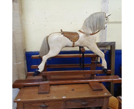 A Victorian style painted wooden rocking horse, 106 cm high 