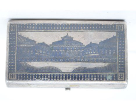 A late 19th century Russian silver and niellowork box, decorated a palace, 1874, 10 cm widesome dents, especially below the b