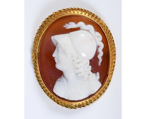 A late 19th century oval hardstone carved cameo brooch, in a yellow coloured metal mount, 4 x 3.5 cmWith a small crack to her