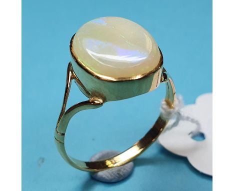 A yellow coloured metal ring, set an oval opal, approx. ring size S½Report by RBWith a Ward & Sibley jeweller's insurance not