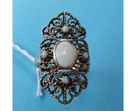 A 9ct gold and opal set filigree ring 