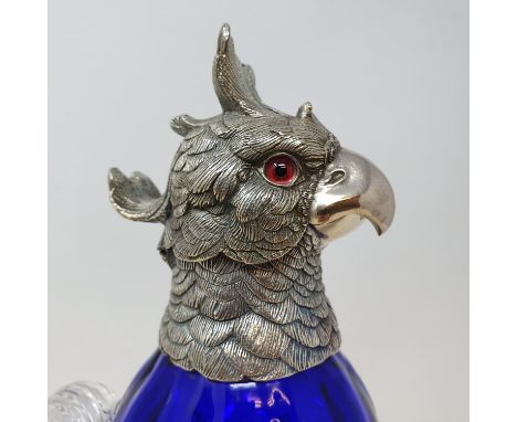 A blue glass decanter, in the form of a parrot, with plated mounts, 28 cm highReport by RBModern 
