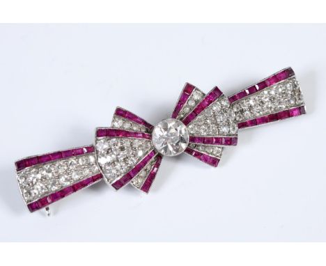 An Art Deco diamond and ruby bow brooch, and a Tessiers, London, boxReport by RBThe property of a lady, from a deceased estat