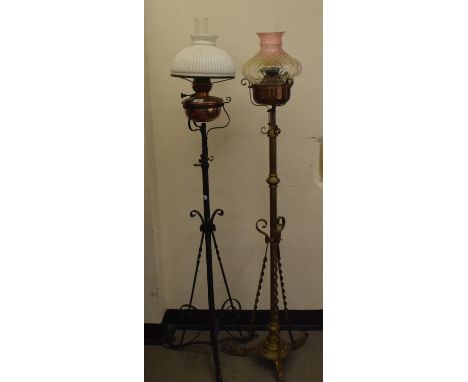 A late 19th/early 20th century brass and cast metal standard lamp, 155 cm, and another (2) 