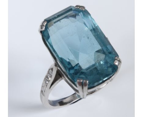 A platinum and aquamarine cocktail ring, with diamonds set to the shoulders, approx. ring size O½19mm across  12mm and approx