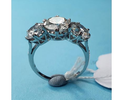 An 18ct white gold and three stone diamond ring, 3.84ct, approx. ring size K½multiple visible inclusions on all stonescentre 