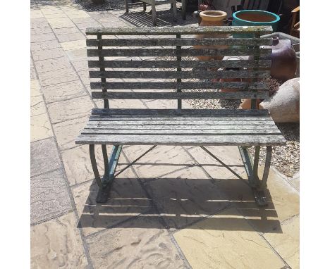 A garden bench, with cast metal ends. 