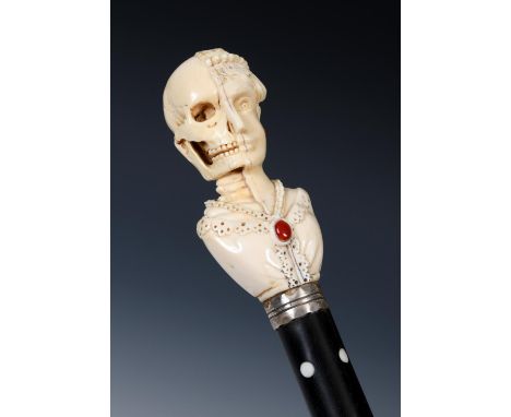 A 19th century memento Mori walking cane, with ivory and jewelled handle, with white metal collar, ebony shaft, original stee