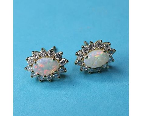 A pair of 18ct gold, opal and diamond earrings, approx. 1ct 