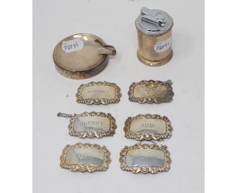 Six modern silver decanter labels, Birmingham 1967, approx. 2.5 ozt, a silver mounted table cigarette lighter, London 1968, a