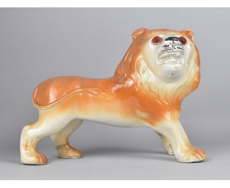 A Large Ceramic Study of a Lion, 26cm high 