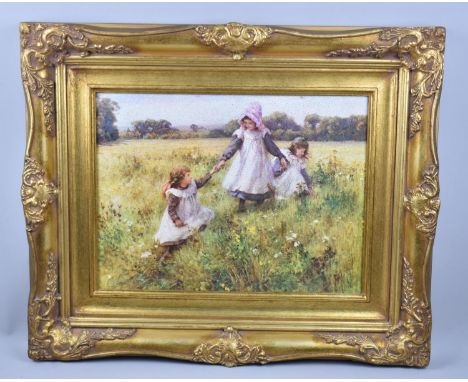 A Reproduction Gilt Framed Print Depicting Children Playing in Meadow, 39x29cms 