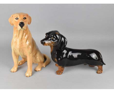 A Beswick Fireside Study of a Labrador, no. 2314 together with an Italian Ceramic Dachshund Example 