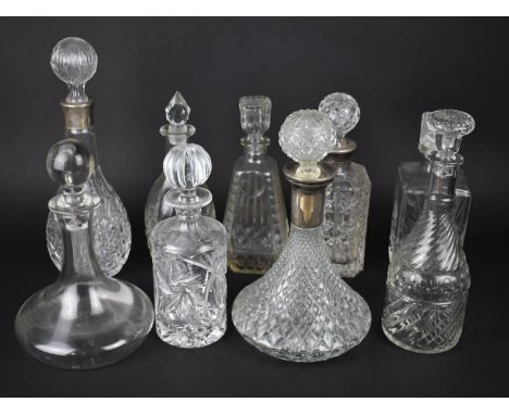 A Collection of Various Glass Decanters to include Ships Decanter with Silver Plated Cuff etc 