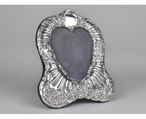 A Silver Photo Frame of Shaped Form Having Scrolled Foliates and Heart Shaped Opening, London Hallmark (Missing Glass), 15x20