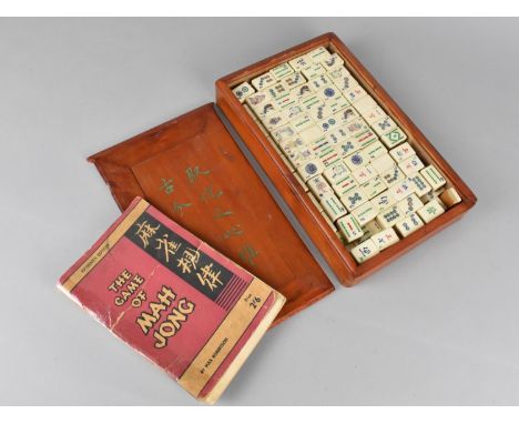 A Cased Bone and Bamboo Mahjong Set with Fifteenth Edition 'The Game of Mahjong' Booklet by Max Robertson 