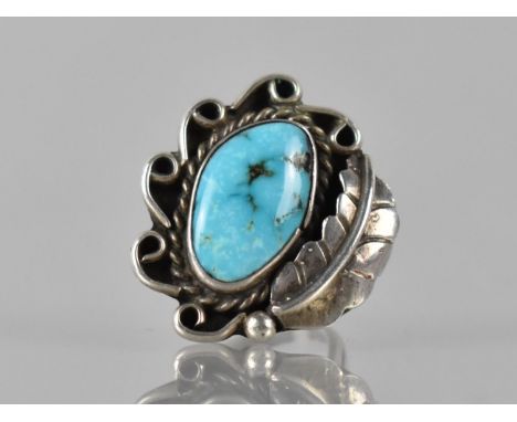 A Large Turquoise Mounted Navajo Ring in Unmarked White Metal, Irregular Turquoise Cabochon Measuring 17mm by 11mm Max with A