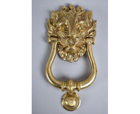 A Reproduction Brass Lion Mask Door Knocker, 23cms High 