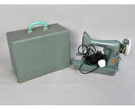 A Vintage Singer Electric Sewing Machine with Power Lead and Foot Pedal 