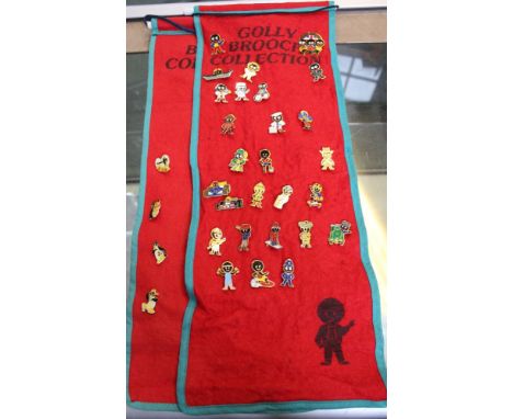 A collection of 31 Robertson's "Golly" badges on two fabric "Golly Brooch Collection" red felt rolls /&nbsp;These items are l