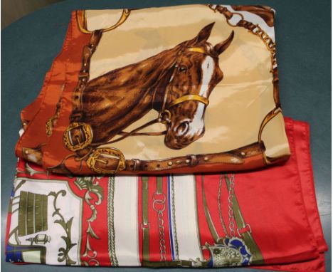 Two Hermes style printed head scarves, one in browns with horse decoration, the other predominantly a red ground with carriag
