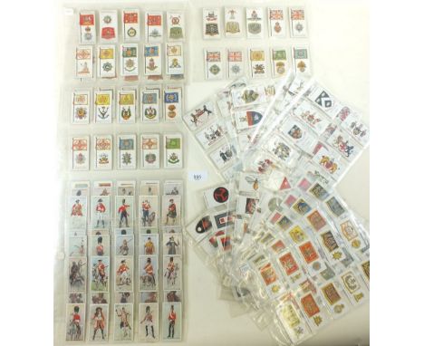 A collection of 250 Wills and John Player cigarette cards of military interest including Badges and Flags of British Regiment