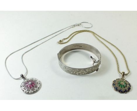 A silver hinged bangle and two silver filigree and enamel pendants and chain